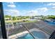 Screened-in pool offers canal views, docks, and lush landscaping at 6509 Dolphin Cove Dr, Apollo Beach, FL 33572