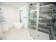 Bathroom featuring standalone tub and glass enclosed shower at 6509 Dolphin Cove Dr, Apollo Beach, FL 33572