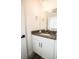 Bathroom with granite countertop, single vanity, chrome fixtures, and decorative lighting at 6509 Dolphin Cove Dr, Apollo Beach, FL 33572