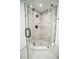 Bathroom boasts a glass shower with gray tile and dark hardware at 6509 Dolphin Cove Dr, Apollo Beach, FL 33572