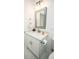 Updated bathroom features white vanity, quartz counters, framed mirror at 6509 Dolphin Cove Dr, Apollo Beach, FL 33572
