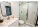 Bathroom features new vanity with stone counter and updated tile shower at 6509 Dolphin Cove Dr, Apollo Beach, FL 33572