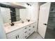 Bathroom featuring double sinks, modern fixtures, and a glass-enclosed shower at 6509 Dolphin Cove Dr, Apollo Beach, FL 33572