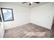 A bright bedroom features neutral carpet and plenty of natural light at 6509 Dolphin Cove Dr, Apollo Beach, FL 33572