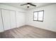 A bright bedroom features neutral carpet, a window, and plenty of closet space at 6509 Dolphin Cove Dr, Apollo Beach, FL 33572