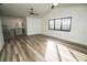 An open concept bonus room features new floors, recessed lighting, & natural light at 6509 Dolphin Cove Dr, Apollo Beach, FL 33572