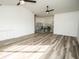 An open concept bonus room features new floors, recessed lighting, & neutral paint at 6509 Dolphin Cove Dr, Apollo Beach, FL 33572
