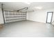 Spacious two-car garage featuring epoxy flooring and an automatic door at 6509 Dolphin Cove Dr, Apollo Beach, FL 33572