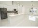 Bright, open kitchen featuring white cabinets, stainless steel appliances, and a large center island at 6509 Dolphin Cove Dr, Apollo Beach, FL 33572