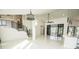Bright living space features modern staircase, high ceilings, polished floors, and an open layout at 6509 Dolphin Cove Dr, Apollo Beach, FL 33572