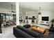 Bright and airy living space featuring an open floor plan connecting to a modern kitchen and dining area at 6509 Dolphin Cove Dr, Apollo Beach, FL 33572