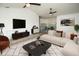 Comfortable living room with stylish decor, a contemporary media center, and plenty of seating for relaxation at 6509 Dolphin Cove Dr, Apollo Beach, FL 33572