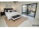 Staged main bedroom featuring ceiling fan and water views at 6509 Dolphin Cove Dr, Apollo Beach, FL 33572