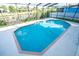 Inviting screened-in pool with brick trim and ample deck space, offering a private outdoor retreat at 6509 Dolphin Cove Dr, Apollo Beach, FL 33572
