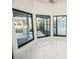 Bright sun room with large windows that offer serene views of the outdoors at 6509 Dolphin Cove Dr, Apollo Beach, FL 33572