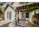 Backyard view of the house with a covered patio at 678 Greenglen Ln, Palm Harbor, FL 34684