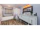 Bathroom featuring a vanity with an antique furniture-style cabinet and a separate tub at 678 Greenglen Ln, Palm Harbor, FL 34684