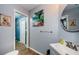 Cozy bathroom featuring a grey painted walls and a round mirror at 678 Greenglen Ln, Palm Harbor, FL 34684