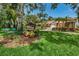 Well-maintained community recreation center sign with vibrant landscaping at 678 Greenglen Ln, Palm Harbor, FL 34684