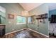 Cozy dining area with ample natural light and views of the backyard landscape at 678 Greenglen Ln, Palm Harbor, FL 34684