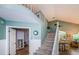 Bright entryway featuring high ceilings, staircase, and an open floor plan at 678 Greenglen Ln, Palm Harbor, FL 34684
