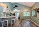 Bright kitchen with gray cabinets, quartz counters, and stainless steel appliances at 678 Greenglen Ln, Palm Harbor, FL 34684