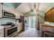 Beautiful kitchen with modern appliances, gray cabinets, and ample natural light at 678 Greenglen Ln, Palm Harbor, FL 34684