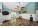 Living room with wood-look tile floors, and wainscotting along the walls at 678 Greenglen Ln, Palm Harbor, FL 34684