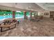 Community pool pavilion with tables and seating for residents at 678 Greenglen Ln, Palm Harbor, FL 34684