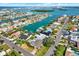 Expansive aerial shot of waterfront homes, canals, and the open ocean beyond at 680 Capri Blvd, Treasure Island, FL 33706