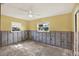 Bedroom needing renovation, bright with natural light through its two windows at 680 Capri Blvd, Treasure Island, FL 33706