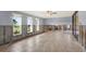 A light and bright living room with three large windows and sliding doors at 680 Capri Blvd, Treasure Island, FL 33706