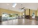 A spacious living room features a cozy fireplace, vaulted ceilings, and glass doors leading to a pool at 680 Capri Blvd, Treasure Island, FL 33706