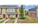 Attractive two-story townhouse with manicured lawn and inviting entrance at 7021 White Treetop Pl, Riverview, FL 33578