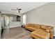 Inviting living room with modern flooring, neutral paint, and open layout to kitchen at 7021 White Treetop Pl, Riverview, FL 33578