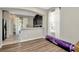 Open floor plan of living room with kitchen area including a breakfast bar and modern finishes at 7021 White Treetop Pl, Riverview, FL 33578