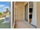 Relaxing screened patio with door to yard and sliding door to interior of home at 7021 White Treetop Pl, Riverview, FL 33578