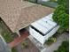 Aerial view of the property showcasing the roof, yard, landscaping, and outdoor space at 7205 San Luis Ct, Tampa, FL 33634