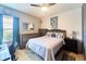 This bedroom is a cozy retreat with its tile floors and ceiling fan for added comfort at 7205 San Luis Ct, Tampa, FL 33634
