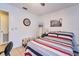 This bedroom features tile floors, neutral walls and is well-lit with natural light at 7205 San Luis Ct, Tampa, FL 33634