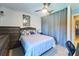 This bedroom has tile floors, a ceiling fan, and a closet, offering comfort and functionality at 7205 San Luis Ct, Tampa, FL 33634