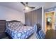 This bedroom features tile floors, a ceiling fan and study desk area at 7205 San Luis Ct, Tampa, FL 33634