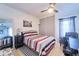 Cozy bedroom with tile floors, study desk and a large closet with sliding doors at 7205 San Luis Ct, Tampa, FL 33634
