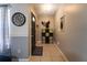 Inviting entryway with tile flooring, stylish decor, and functional storage solutions at 7205 San Luis Ct, Tampa, FL 33634
