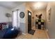 Inviting entryway with tile flooring, stylish decor, and functional storage solutions at 7205 San Luis Ct, Tampa, FL 33634