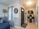 Inviting foyer features neutral paint, tile flooring, and practical storage solutions for an organized entrance at 7205 San Luis Ct, Tampa, FL 33634