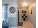 Inviting foyer features neutral paint, tile flooring, and practical storage solutions for an organized entrance at 7205 San Luis Ct, Tampa, FL 33634