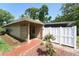 Charming home featuring a welcoming entrance, a privacy fence and neatly manicured landscaping at 7205 San Luis Ct, Tampa, FL 33634