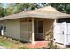 Charming home featuring a welcoming entrance, a privacy fence and neatly manicured landscaping at 7205 San Luis Ct, Tampa, FL 33634