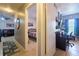 Inviting interior showcasing seamless flow into bedroom and office space with neutral walls and tiled floors at 7205 San Luis Ct, Tampa, FL 33634